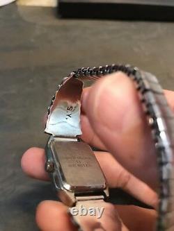 NAVAJO NATIVE AMERICAN STERLING SILVER VINTAGE MOP PAWN WATCH, signed SY